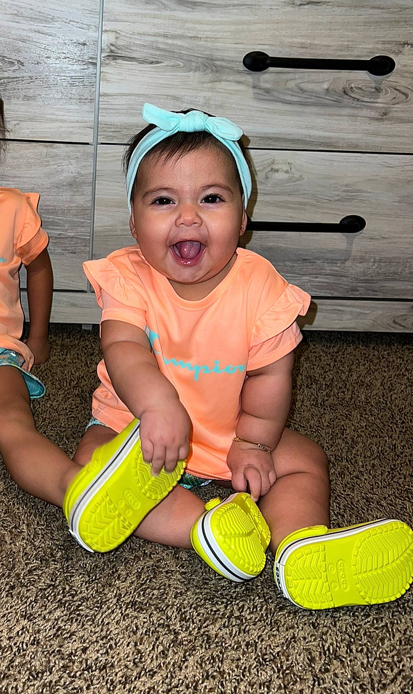 Emma joined the competition — help win amazing prizes! baby_toddler_clothing, ball, cap, cool, football, fun, grass, happy, hat, knee, person, shoe, shorts, sneakers, sports_equipment, standing, summer, t_shirt, toddler, white