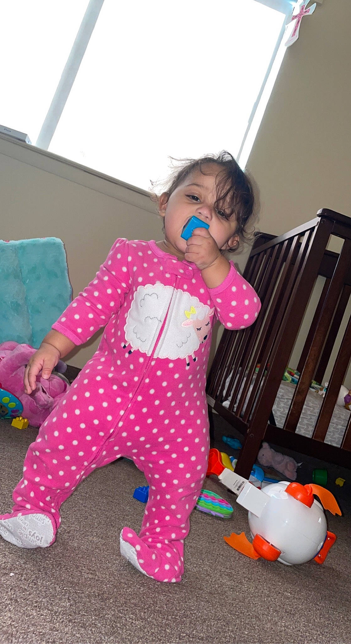 Bianca is registered to the contest to win money with this photo: baby, baby_products, baby_safety, baby_toddler_clothing, baby_toys, child, cradle, fun, happy, magenta, pattern, person, pink, play, room, shoe, sitting, sleeve, sock, toddler