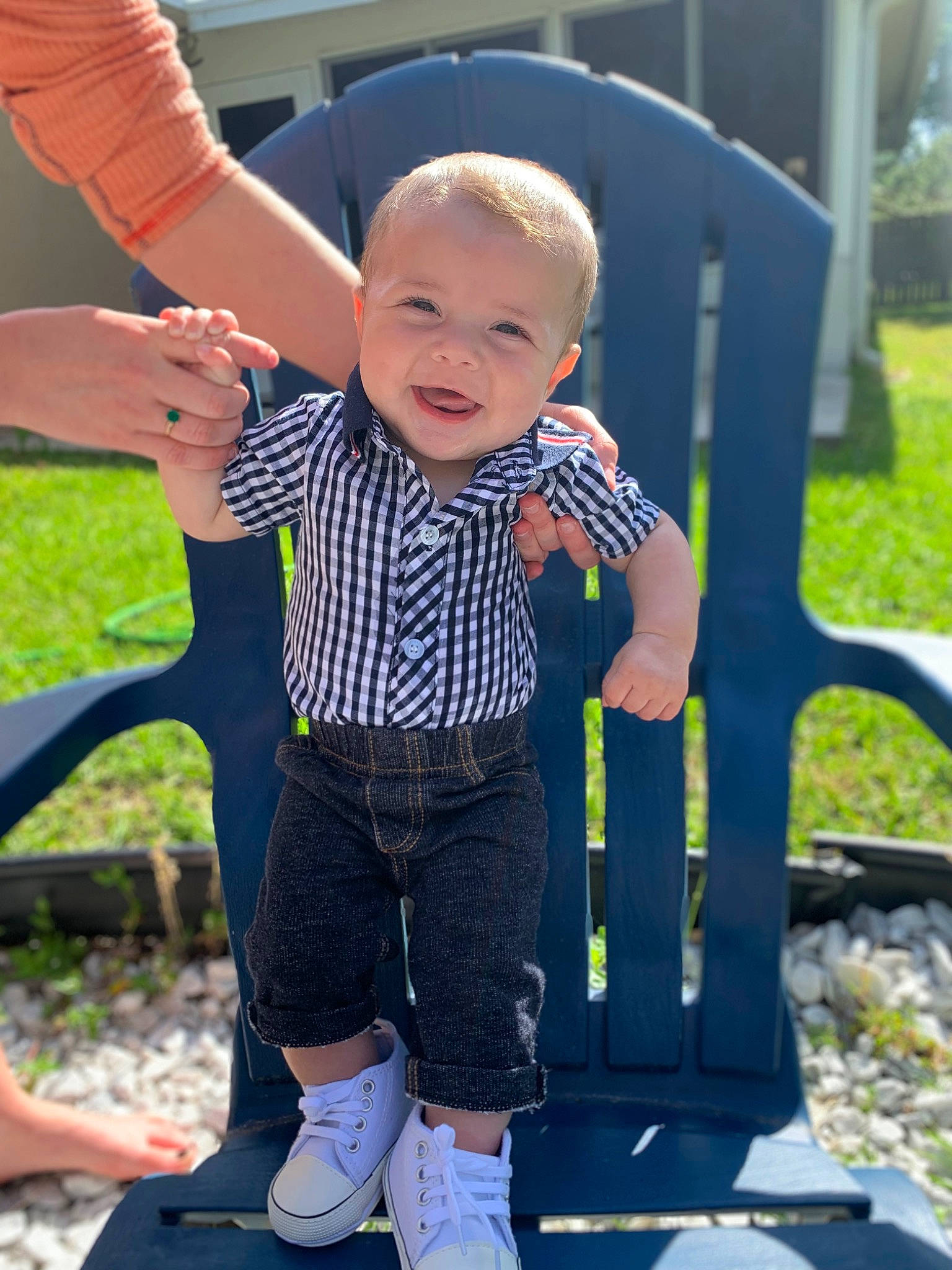 Cannon is registered to the contest to win money with this photo: baby_toddler_clothing, black, chair, face, facial_expression, finger, grass, hairstyle, hand, happy, head, human_body, leg, leisure, person, photograph, product, purple, skin, sleeve
