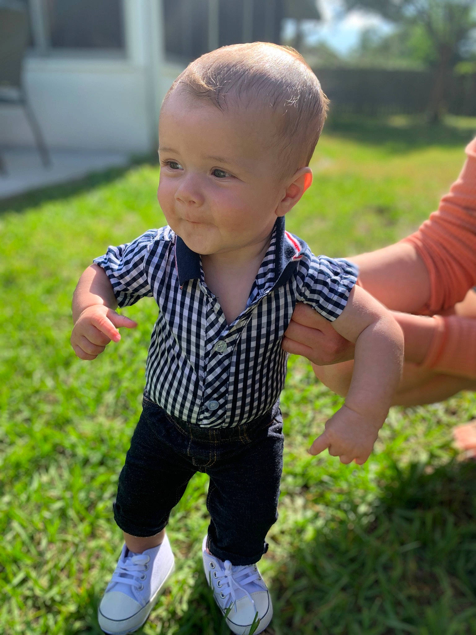 Cannon is registered to the contest to win money with this photo: baby, baby_toddler_clothing, face, facial_expression, finger, fun, gesture, grass, happy, head, leaf, leisure, people_in_nature, person, plant, skin, smile, standing, sunlight, thumb