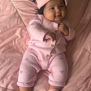 Leilani is registered to the contest to win money with this photo: baby, babylaughing, blanket, clothing, face, happy, head, hosiery, pajamas, person, smile, sock, yawning