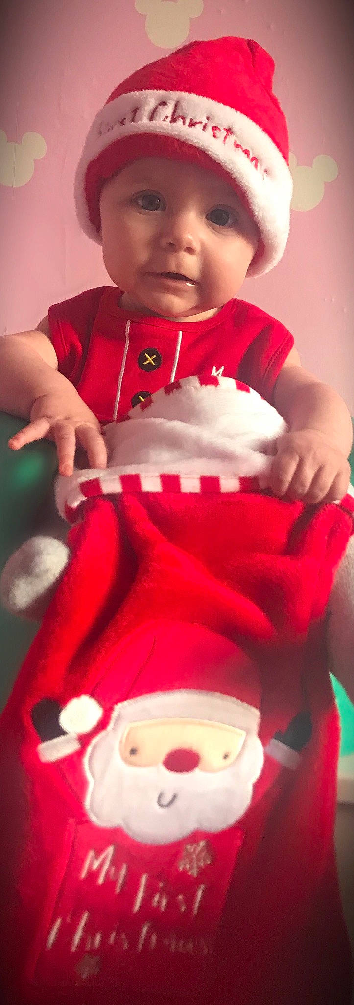 Maizie is registered to the contest to win money with this photo: child, christmas, fictional_character, fun, headwear, holiday, infant, person, product, red, santa_claus, skin, smile, toddler