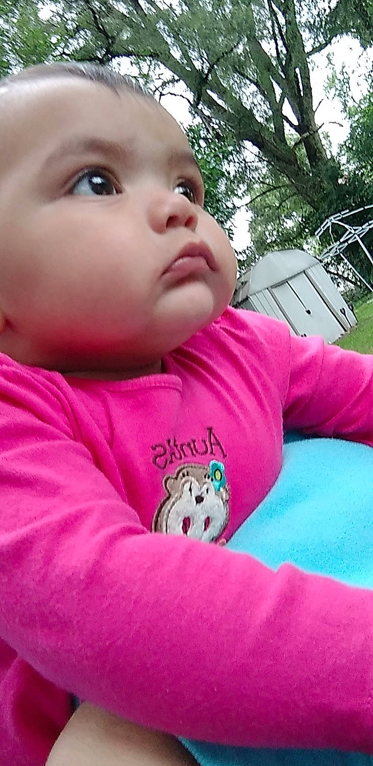 Kallie is registered to the contest to win money with this photo: baby, baby_toddler_clothing, cheek, cool, eye, eyelash, facial_expression, grass, happy, headwear, lip, mouth, nose, organ, person, photograph, pink, plant, skin, sleeve