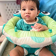 Elliana joined the competition — help win amazing prizes! baby, child, infant, bouncer, toy, indoor, seated, curious, clothing, face, hands, legs, carpet, blanket, furniture, expression, closeup, young, cute, playtime