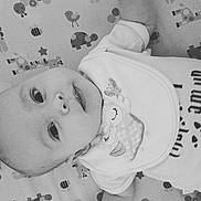 Olive is registered to the contest to win money with this photo: black, black_and_white, cheek, child, drawing, emotion, eye, face, facial_expression, forehead, head, infant, monochrome_photography, nose, person, photograph, photography, product, skin, white