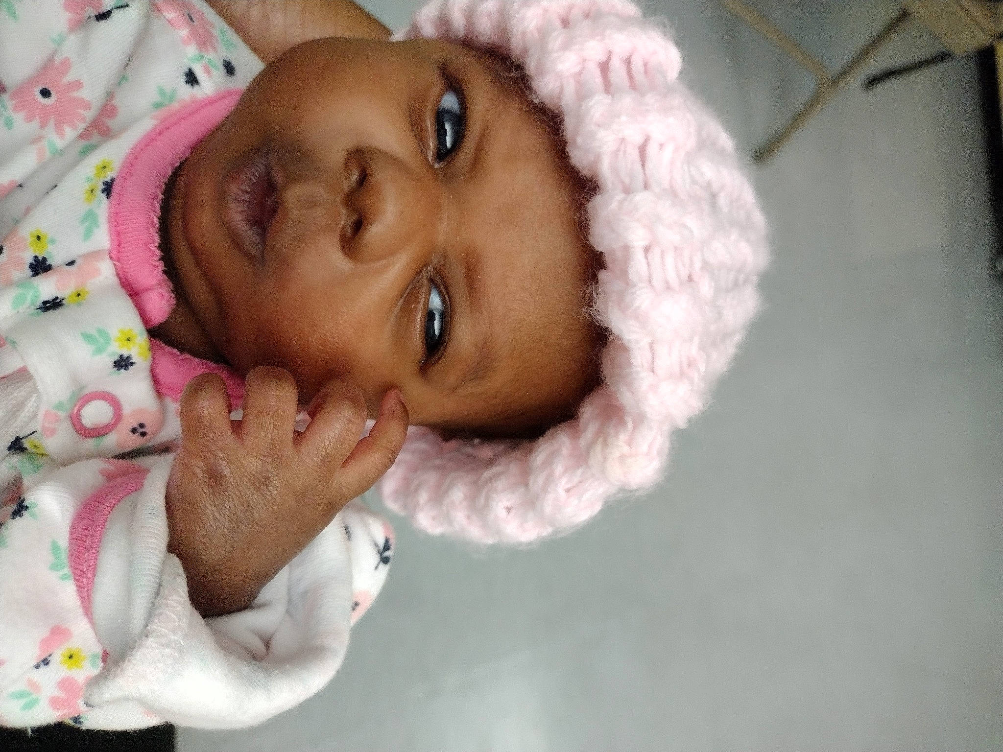 Amari is registered to the contest to win money with this photo: baby, cheek, chin, eye, eyebrow, eyelash, face, finger, gesture, hair, happy, head, headwear, iris, lip, nose, person, pink, skin, sleeve