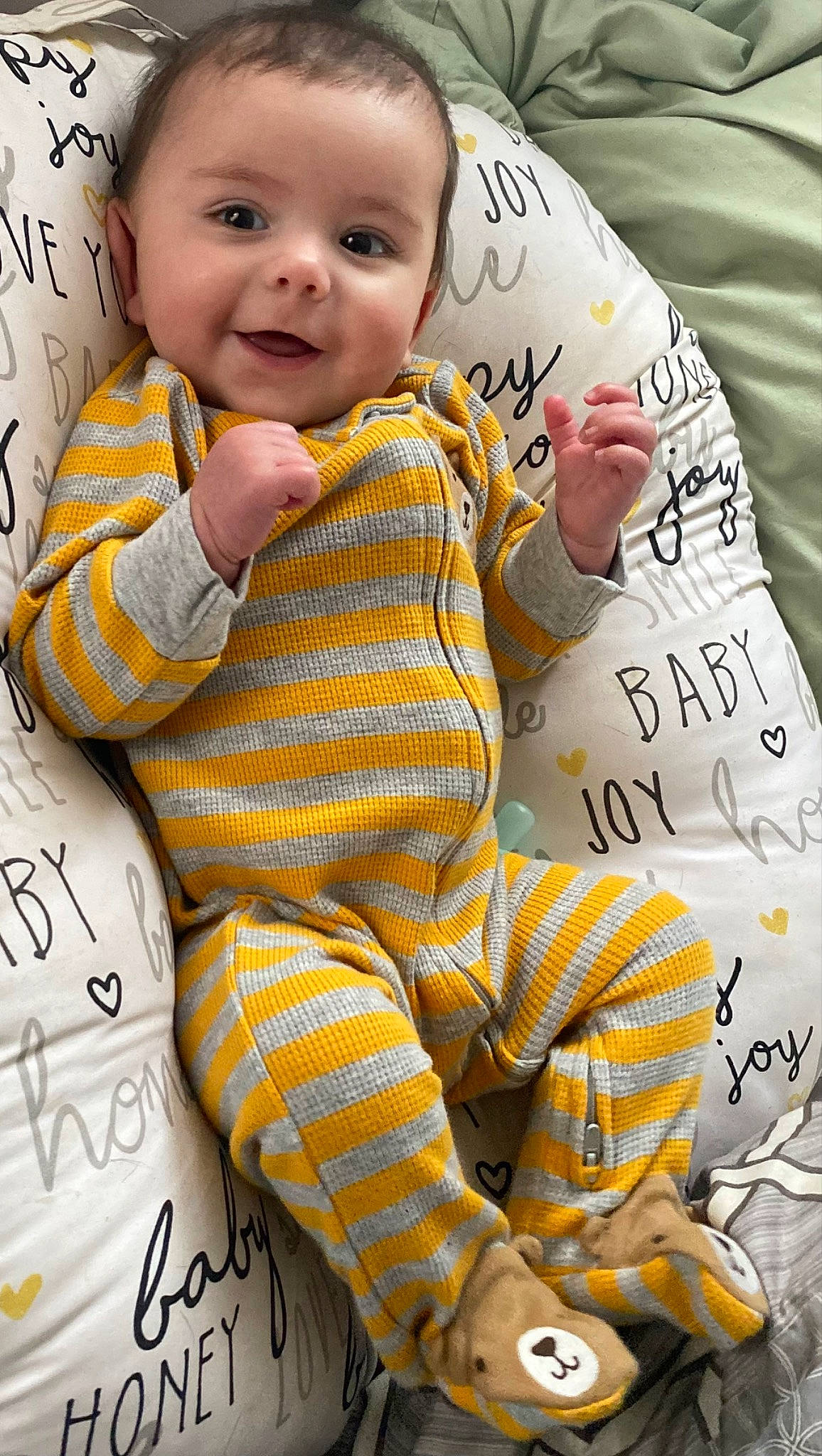 James is registered to the contest to win money with this photo: baby, baby_toddler_clothing, beauty, cheek, comfort, facial_expression, happy, human, leg, linens, people, person, product, skin, sleeve, smile, t_shirt, textile, thigh, toddler