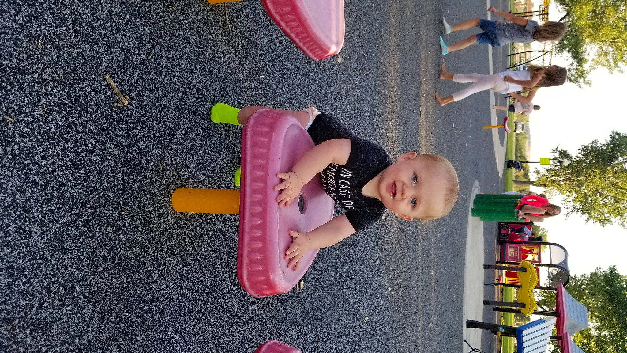 Timothy joined the competition — help win amazing prizes! asphalt, child, city, fun, human_settlement, leisure, line, magenta, person, pink, play, product, public_space, recreation, red, room, smile, toddler, toy, tree