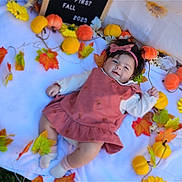 Kaira is registered to the contest to win money with this photo: baby, child, infant, autumn, fall, leaves, pumpkins, blanket, headband, smile, outdoor, seasonal, decoration, cute, portrait, clothing, nature, colorful, happy, photography