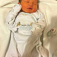 Benjamin joined the competition — help win amazing prizes! newborn, baby, sleeping, infant, onesie, clothing, blanket, pacifier, cute, peaceful, soft, animal_prints, white, resting, indoors, child, portrait, lying_down, young, calm