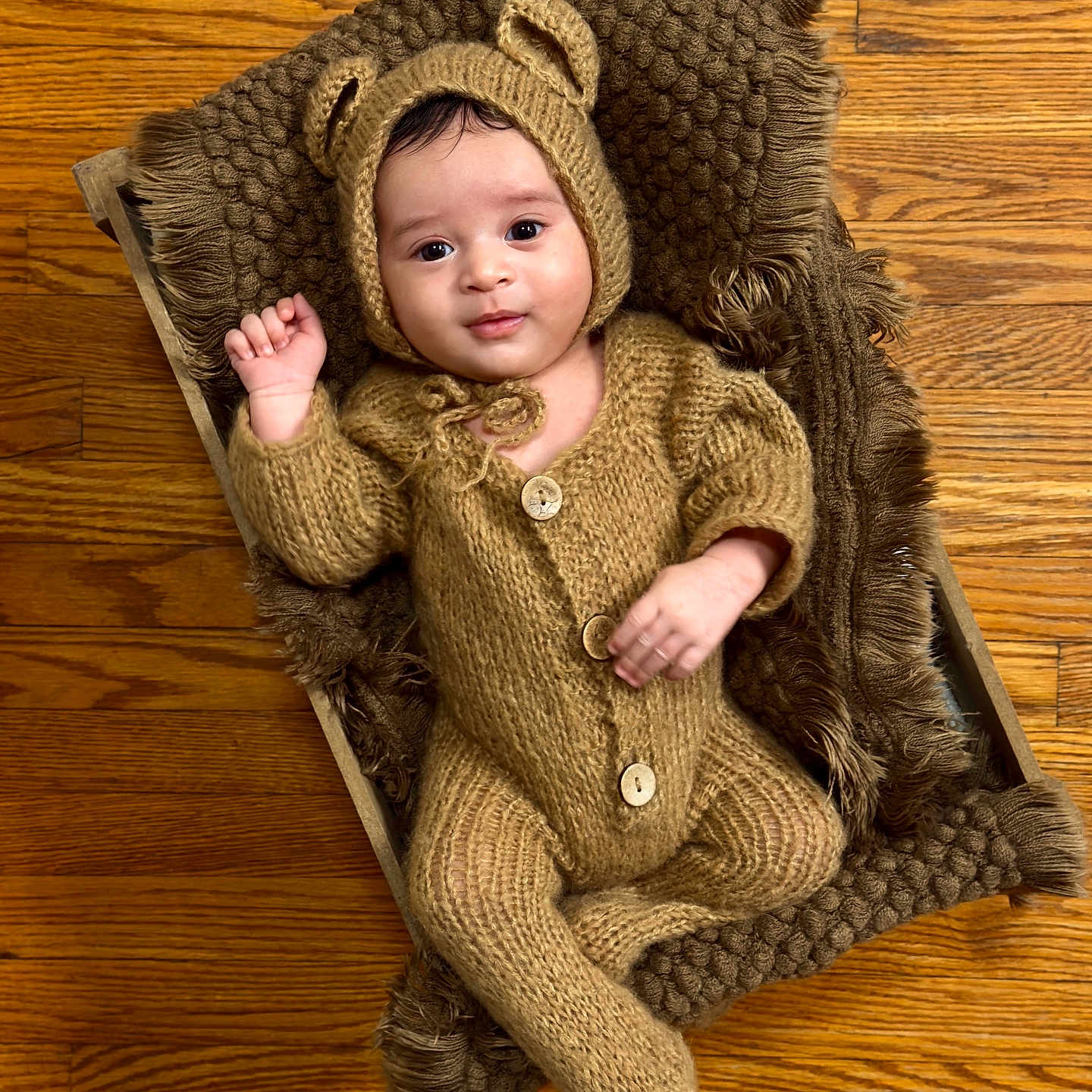 Jareck is registered to the contest to win money with this photo: baby, bonnet, cap, chair, clothing, face, furniture, happy, hardwood, hat, head, hood, hoodie, knitwear, person, photography, portrait, sweater, sweatshirt, wood