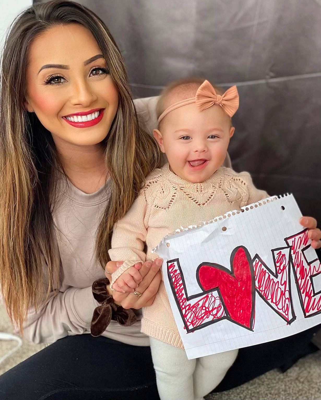 Kalani is registered to the contest to win money with this photo: baby_toddler_clothing, child, eye, eyelash, face, facial_expression, gesture, hair, hairstyle, happy, head, human, iris, joy, lip, organ, person, skin, sleeve, smile