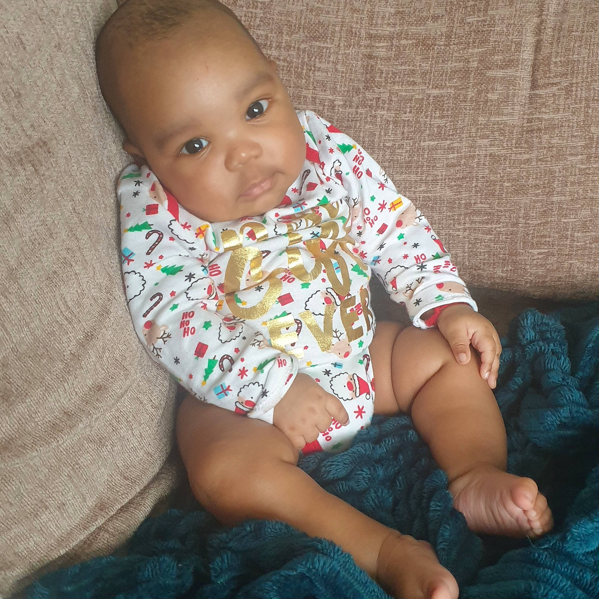 Akeem joined the competition — help win amazing prizes! baby, baby_toddler_clothing, blue, cheek, comfort, eye, facial_expression, finger, human_body, iris, joint, knee, lap, mouth, neck, person, skin, sleeve, standing, thigh