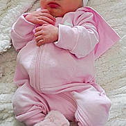 Naitilyn is registered to the contest to win money with this photo: baby, newborn, sleeping, pink_clothing, headband, bow, blanket, soft_texture, cozy, fur_booties, infant, cute, portrait, hands, closed_eyes, resting, indoors, warm, peaceful, child