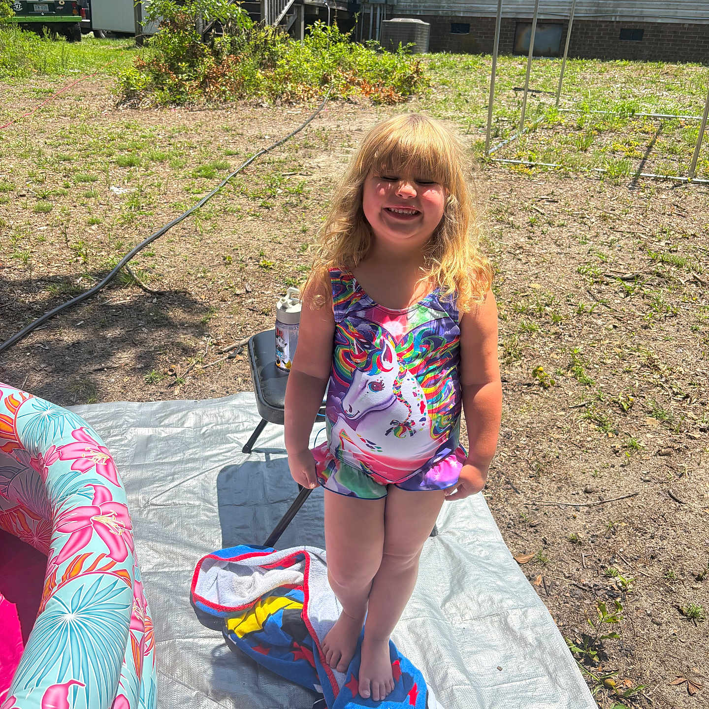Angel joined the competition — help win amazing prizes! backyard, barefoot, chair, child, fun, grass, happy, inflatable, outdoor, person, play, pool, smiling, summer, sunlight, swimsuit, towel, unicorn, water_bottle, young