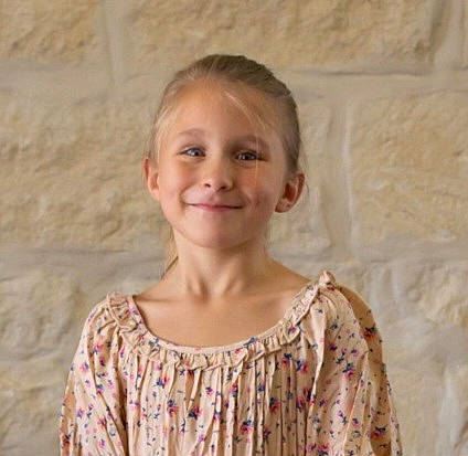 Emmalie is registered to the contest to win money with this photo: blond, cheek, child, chin, day_dress, embellishment, event, fun, happy, iris, jaw, joy, neck, pattern, person, portrait, portrait_photography, sleeve, smile, vacation