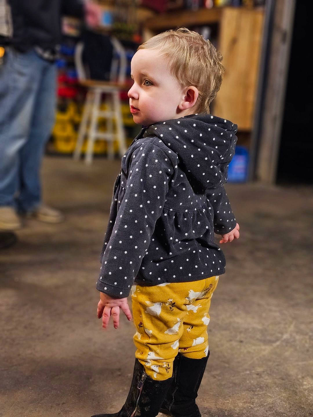 Ella is registered to the contest to win money with this photo: baby, baby_toddler_clothing, child, event, face, fashion_design, fun, high_heels, human_leg, joint, knee, leg, leggings, orange, pattern, person, sandal, sleeve, thigh, toddler