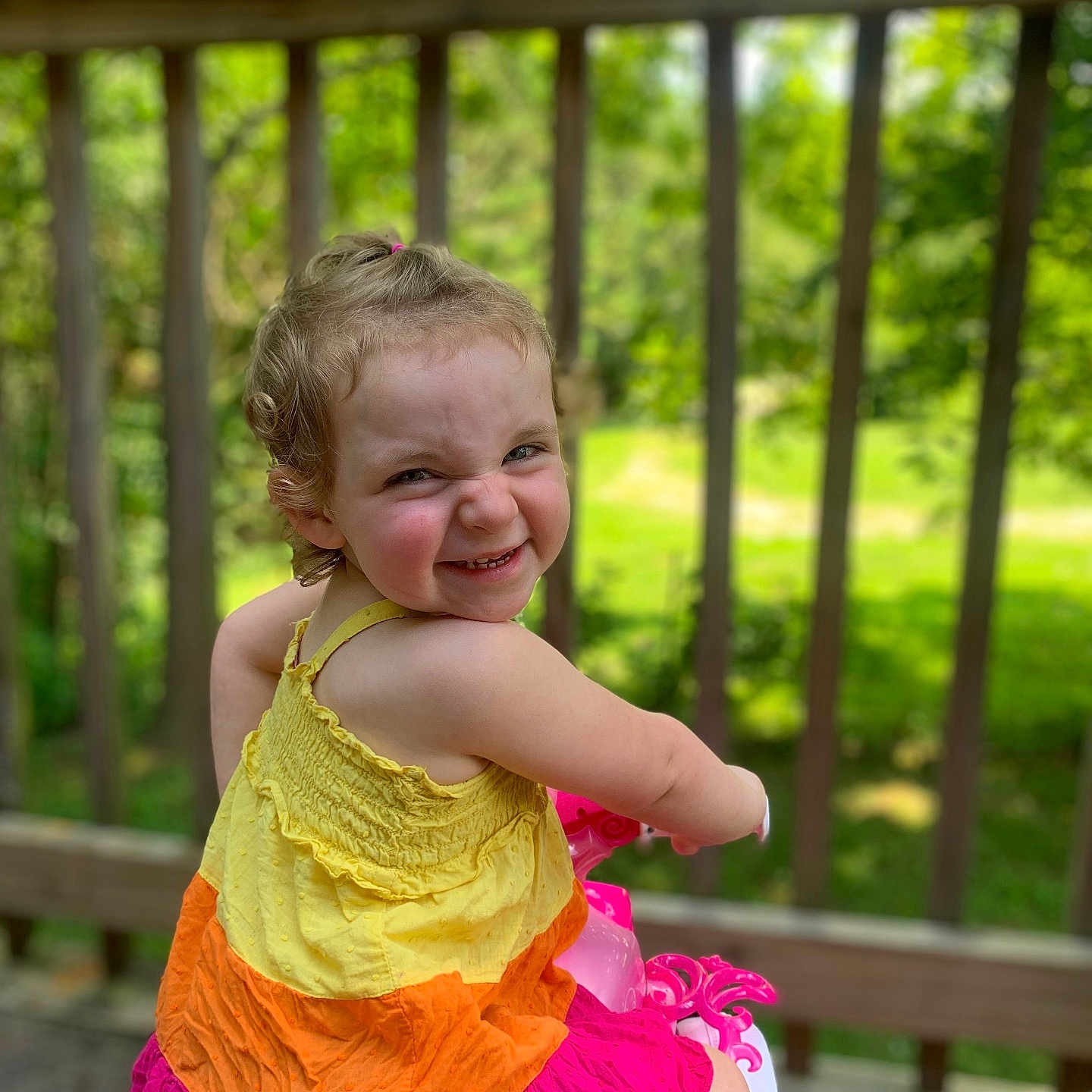 Ella is registered to the contest to win money with this photo: architecture, baby, backyard, building, clothing, dress, face, grass, head, house, housing, nature, outdoors, person, photography, plant, porch, portrait, summer, yard