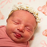 Verafaye is registered to the contest to win money with this photo: newborn, baby, sleeping, face, headband, flower, pink, blanket, teddy_bear, pattern, tongue, closeup, infant, cute, soft, portrait, child, indoors, peaceful, resting