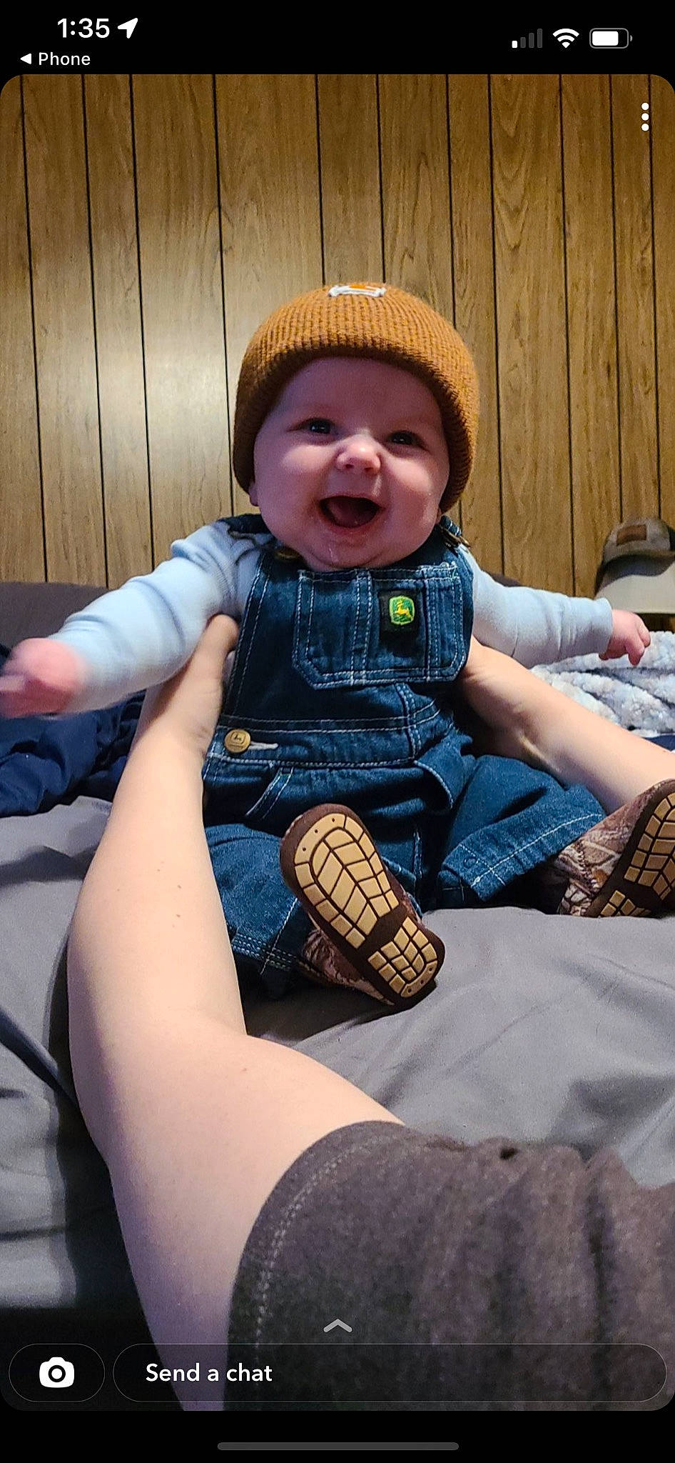 Colten is registered to the contest to win money with this photo: baby_toddler_clothing, comfort, cool, denim, face, fun, happy, head, headgear, headwear, human_leg, knee, lap, person, purple, skin, sleeve, smile, sock, thigh