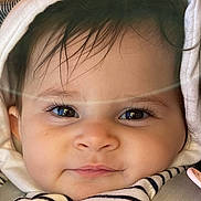 Hind participe au concours pour gagner de l'argent avec cette photo : baby, child, face, hood, striped_clothing, closeup, eyelashes, cute, infant, person, portrait, soft_light, car_seat, pacifier, smile, skin, hair, clothing, warm, indoors