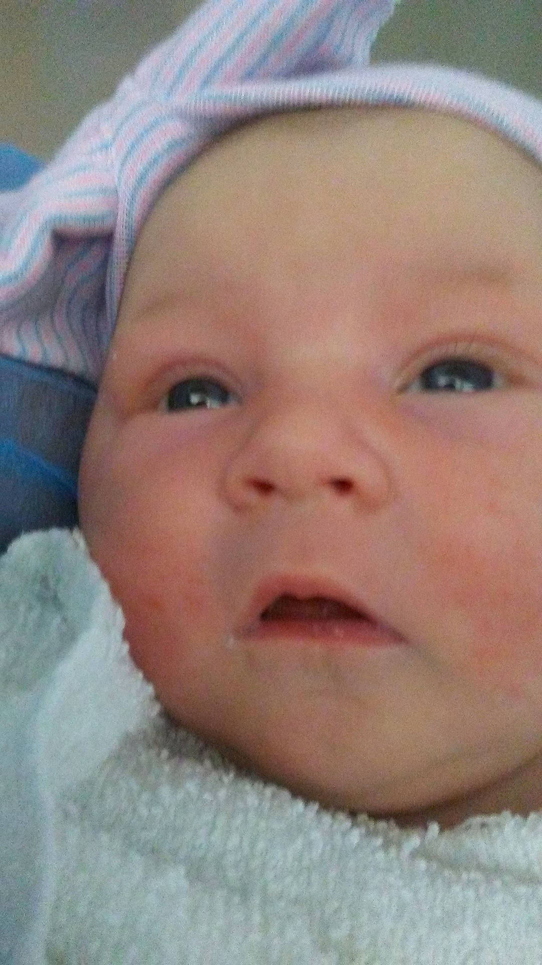 Mallie is registered to the contest to win money with this photo: cheek, child, chin, close_up, ear, eye, eyebrow, face, finger, forehead, head, human_hair_color, infant, jaw, lip, mouth, nose, person, skin, smile