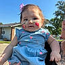 Remi joined the competition — help win amazing prizes! baby, child, face_paint, blue_dress, pink_hearts, outdoor, sunny_day, sky, trees, person_holding, portrait, cute, infant, hand, face, smile, ribbon, hair, grass, building