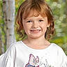 Savannah is registered to the contest to win money with this photo: child, girl, smiling, portrait, red_hair, brown_hair, freckles, outdoor, nature, forest, trees, white_shirt, butterfly, floral_design, standing, happy, face, head, daylight, photography