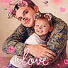 child, adult, smiling, hugging, portrait, selfie, family, camouflage, uniform, animal_filter, cat_ears, nose_filter, hearts, sparkles, pink, love, indoors, close_up, digital_effects, happy