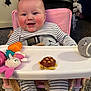 Noah-James joined the competition — help win amazing prizes! baby, high_chair, striped_clothing, toy_carrot, toy_bunny, toy_turtle, toy_mouse, smiling, indoor, carpet, child, seat_belt, pink_chair, happy, plush_toy, face, person, cute, infant, playtime
