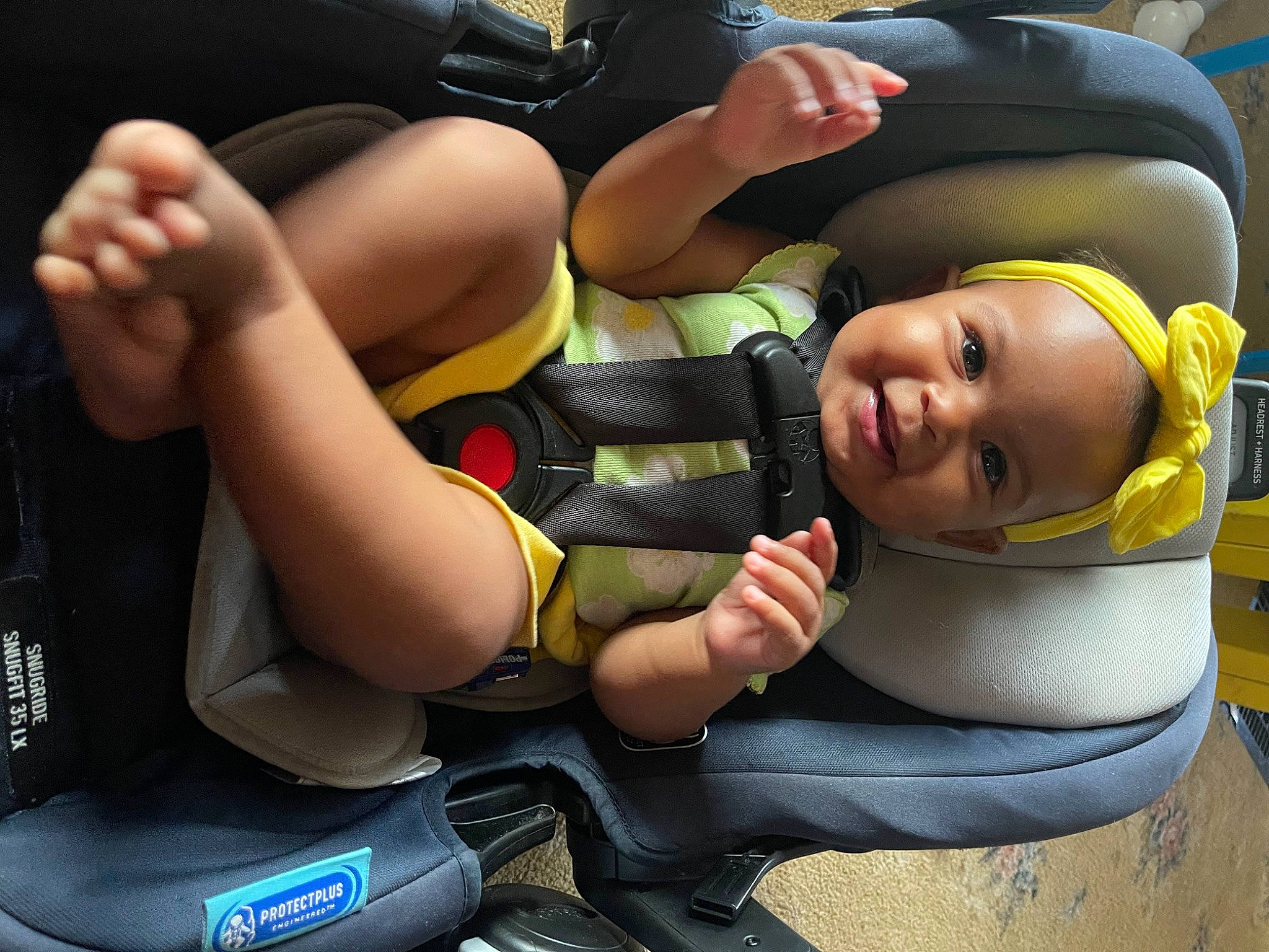 Lenyx is registered to the contest to win money with this photo: auto_part, baby_products, car_seat, child, comfort, finger, gesture, grass, happy, human_leg, joy, knee, leisure, person, personal_protective_equipment, recreation, shorts, smile, sports_gear, thigh