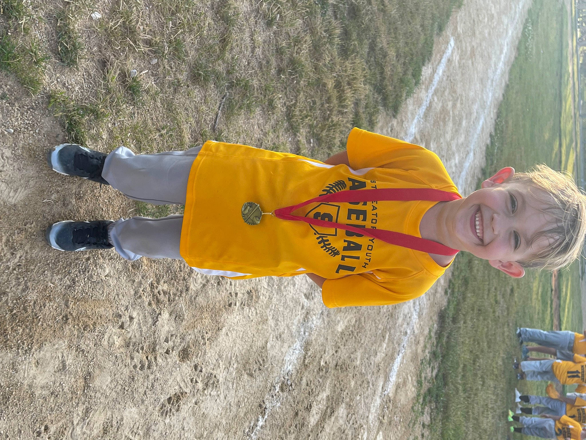 Maddox joined the competition — help win amazing prizes! asphalt, fun, grass, happy, hat, joy, leisure, people_in_nature, person, recreation, shadow, smile, soil, sportswear, t_shirt, toddler, walking_shoe, water