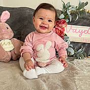 Vayda is registered to the contest to win money with this photo: baby, bodypart, clothing, cushion, face, finger, flower, happy, head, homedecor, pants, person, photography, plant, plush, portrait, sitting, sleeve, smile, toy