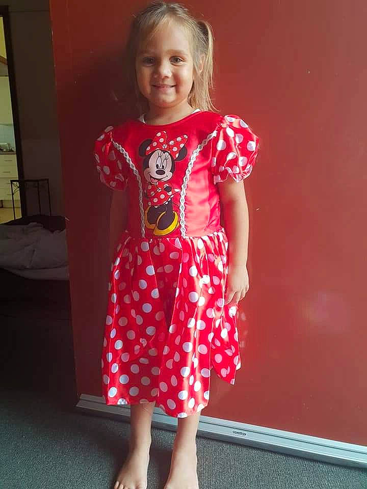 Ruby is registered to the contest to win money with this photo: child, child_model, clothing, day_dress, dress, joy, one_piece_garment, pattern, person, red, sleeve, smile, toddler