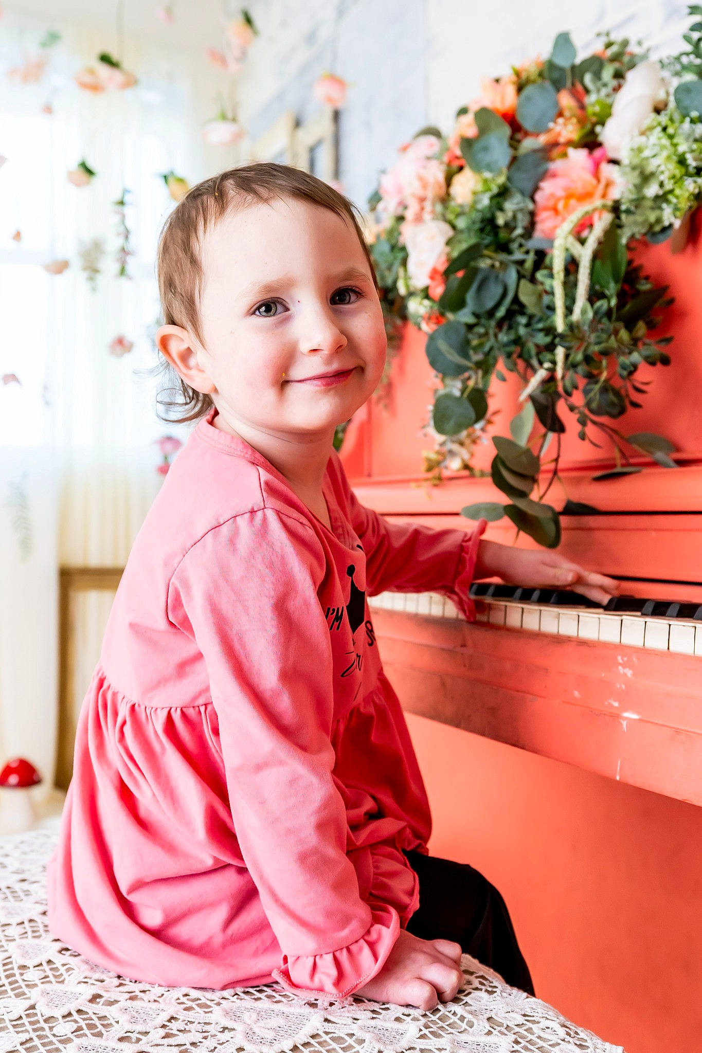 Rias is registered to the contest to win money with this photo: child, christmas, event, floral_design, flower_arranging, happy, human_body, joy, magenta, orange, peach, person, petal, pink, plant, rose, skin, sleeve, smile, standing