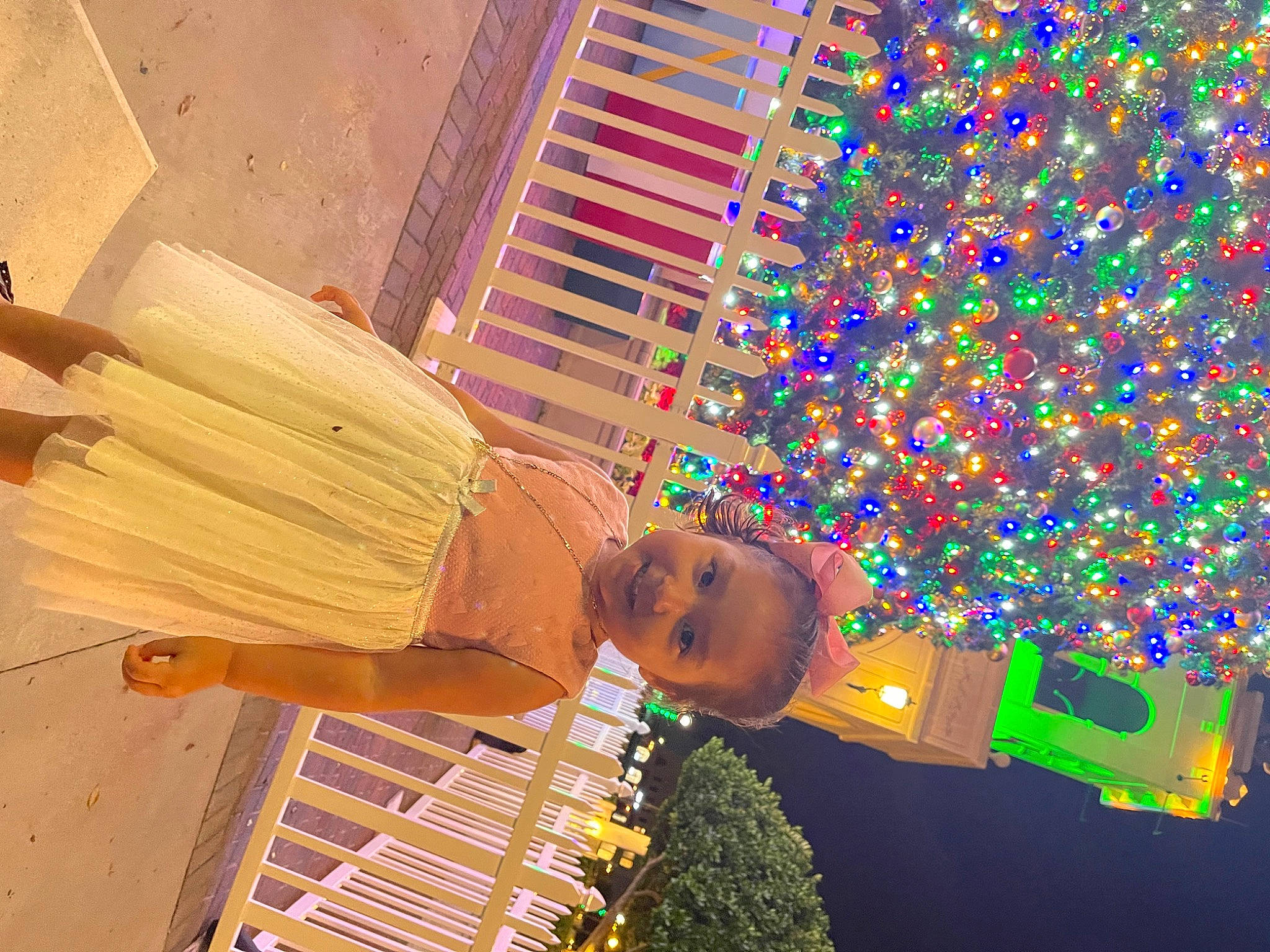 Desiree joined the competition — help win amazing prizes! building, child, christmas_decoration, christmas_lights, christmas_ornament, christmas_tree, conifer, event, flooring, fun, holiday, joy, leisure, light, magenta, ornament, pattern, person, plant, room