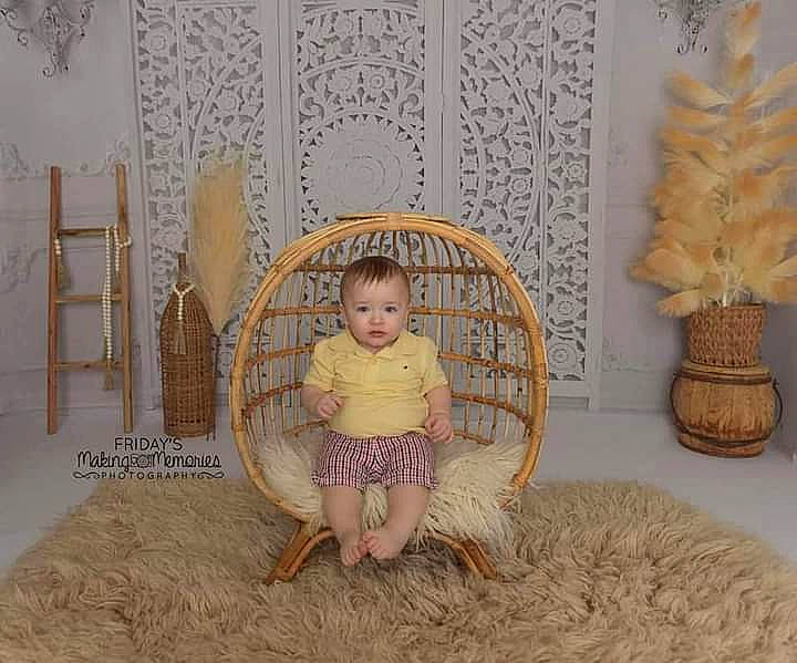 Andrew is registered to the contest to win money with this photo: art, baby, baby_toddler_clothing, chair, comfort, face, fawn, floor, flooring, hardwood, mammal, pattern, person, photograph, room, sitting, textile, toddler, vertebrate, white