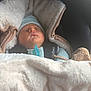 baby, newborn, sleeping, blanket, car_seat, pacifier, hat, cozy, child, infant, soft, warm, secured, cute, peaceful, indoors, clothing, resting, person, portrait