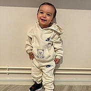 Lyano a rejoint le concours — aidez-le/la à gagner de superbes lots ! toddler, child, smiling, standing, hoodie, tracksuit, nike, bear_design, shoes, indoor, floor, wall, happy, cute, clothing, person, portrait, young_child, casual, footwear