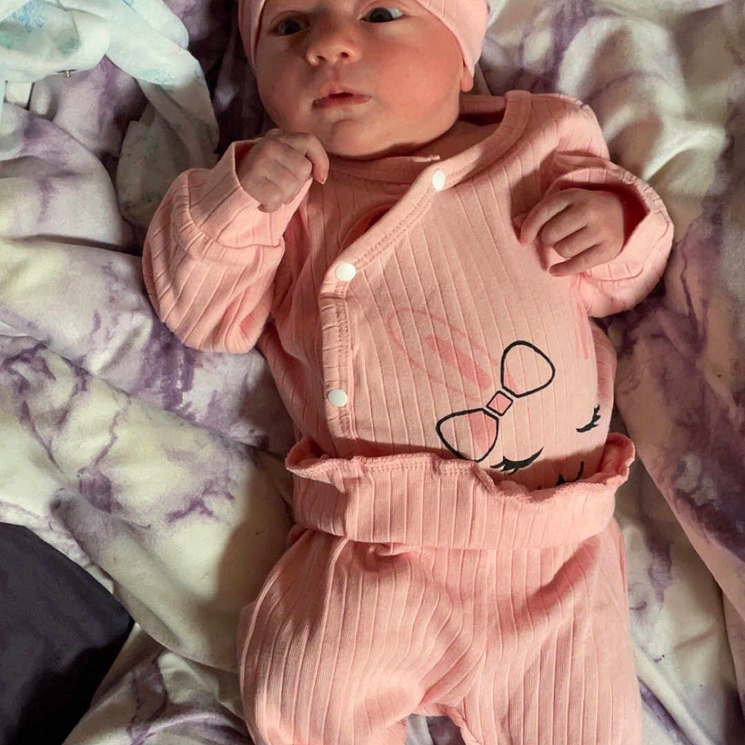 Adalyn joined the competition — help win amazing prizes! architecture, baby, bed, blanket, bonnet, building, cap, clothing, costume, couch, face, furniture, hat, head, newborn, pants, person, photography, portrait, quilt