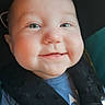 baby, infant, smiling, face, car_seat, safety_harness, blue_shirt, child, cute, closeup, head, cheeks, happy, straps, seatbelt, person, portrait, indoors, young_child, expression