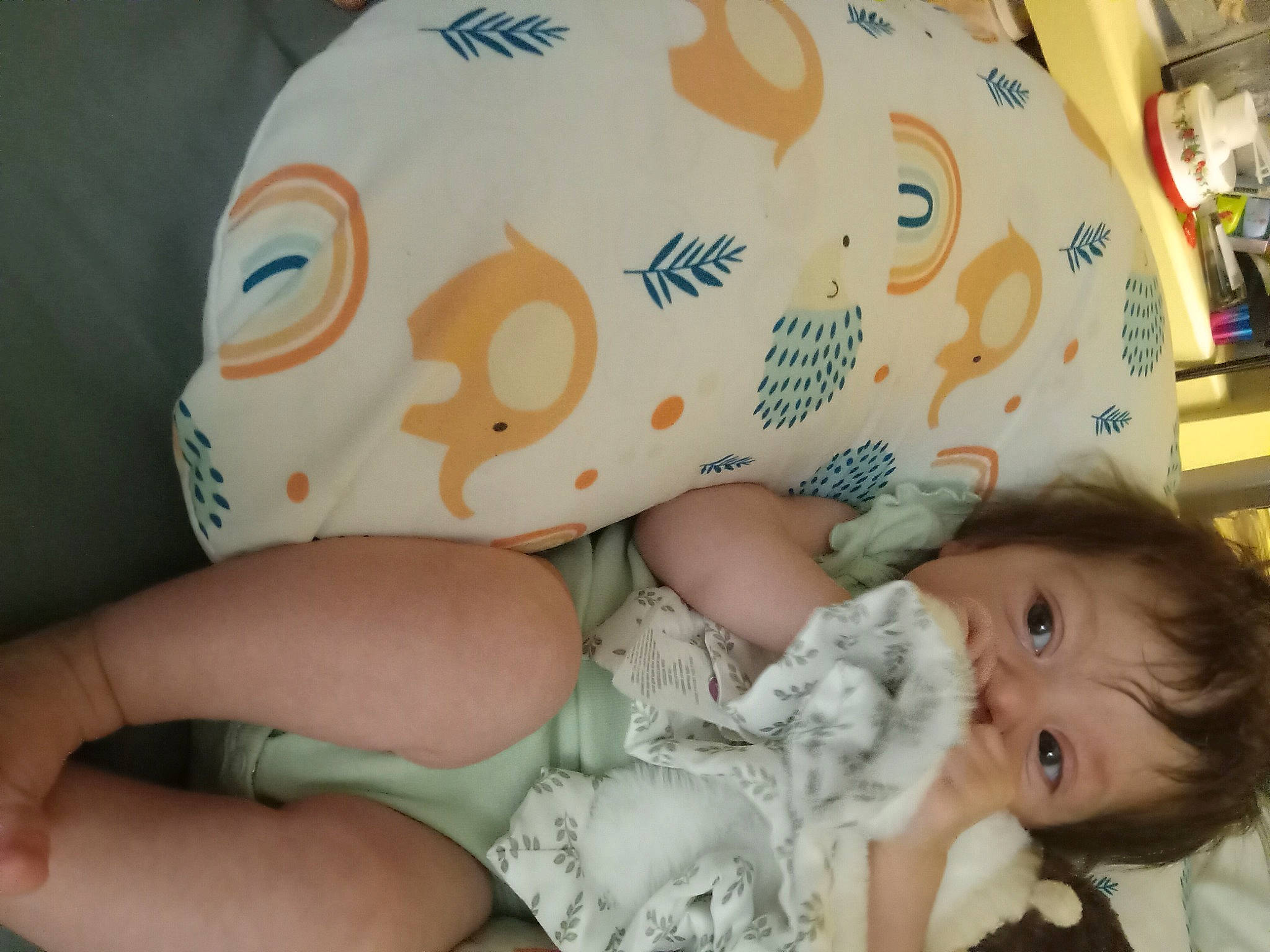 Rosy is registered to the contest to win money with this photo: baby, baby_toddler_clothing, cheek, child, comfort, eye, facial_expression, finger, happy, human_body, linens, mammal, mouth, nose, pattern, person, skin, textile, thigh, toddler