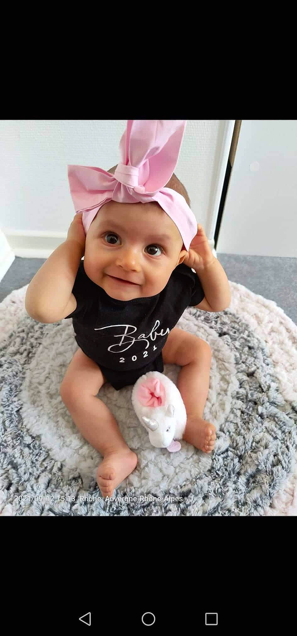Raphaëlle participe au concours pour gagner de l'argent avec cette photo : baby, baby_toddler_clothing, cap, child, costume_hat, face, fashion_accessory, fun, happy, headband, headpiece, headwear, joy, magenta, party_supply, person, pink, purple, sleeve, smile