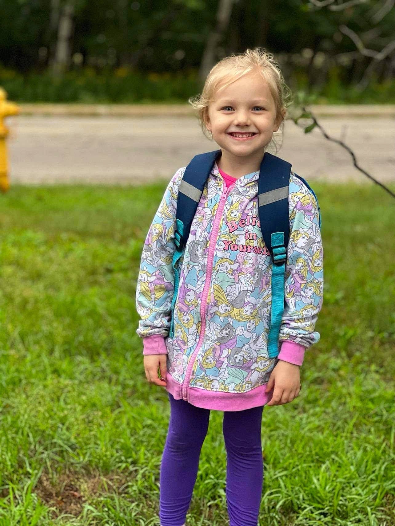 Karmyn is registered to the contest to win money with this photo: blond, child, eye, fun, grass, grass_family, grassland, hair, happy, joy, leisure, outerwear, pattern, people_in_nature, person, plant, recreation, sleeve, smile, soil