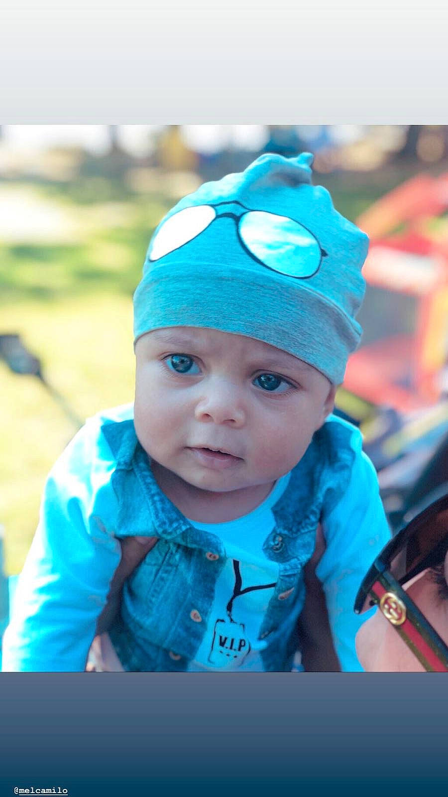 Avyn is registered to the contest to win money with this photo: baby, beanie, blue, cap, child, cool, ear, eye, fashion_accessory, headgear, person, photography, portrait_photography, smile, toddler, turquoise