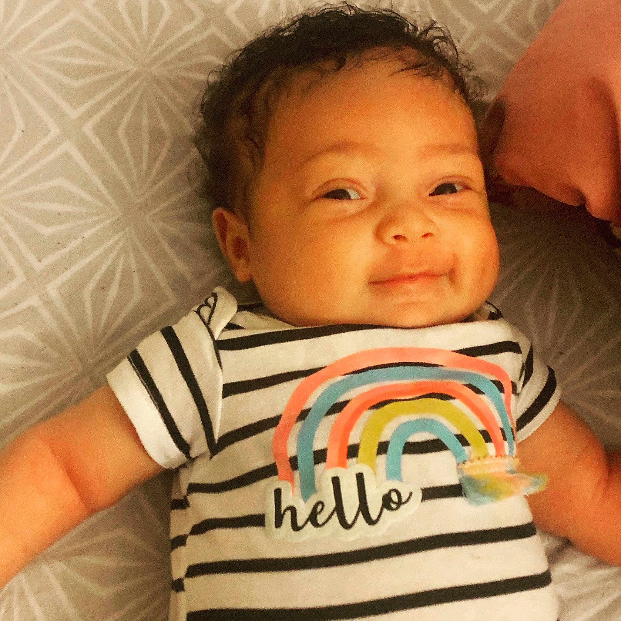 Malani is registered to the contest to win money with this photo: baby, baby_toddler_clothing, cheek, chin, comfort, ear, eye, eyebrow, face, forehead, happy, head, iris, mouth, neck, nose, person, skin, sleeve, smile