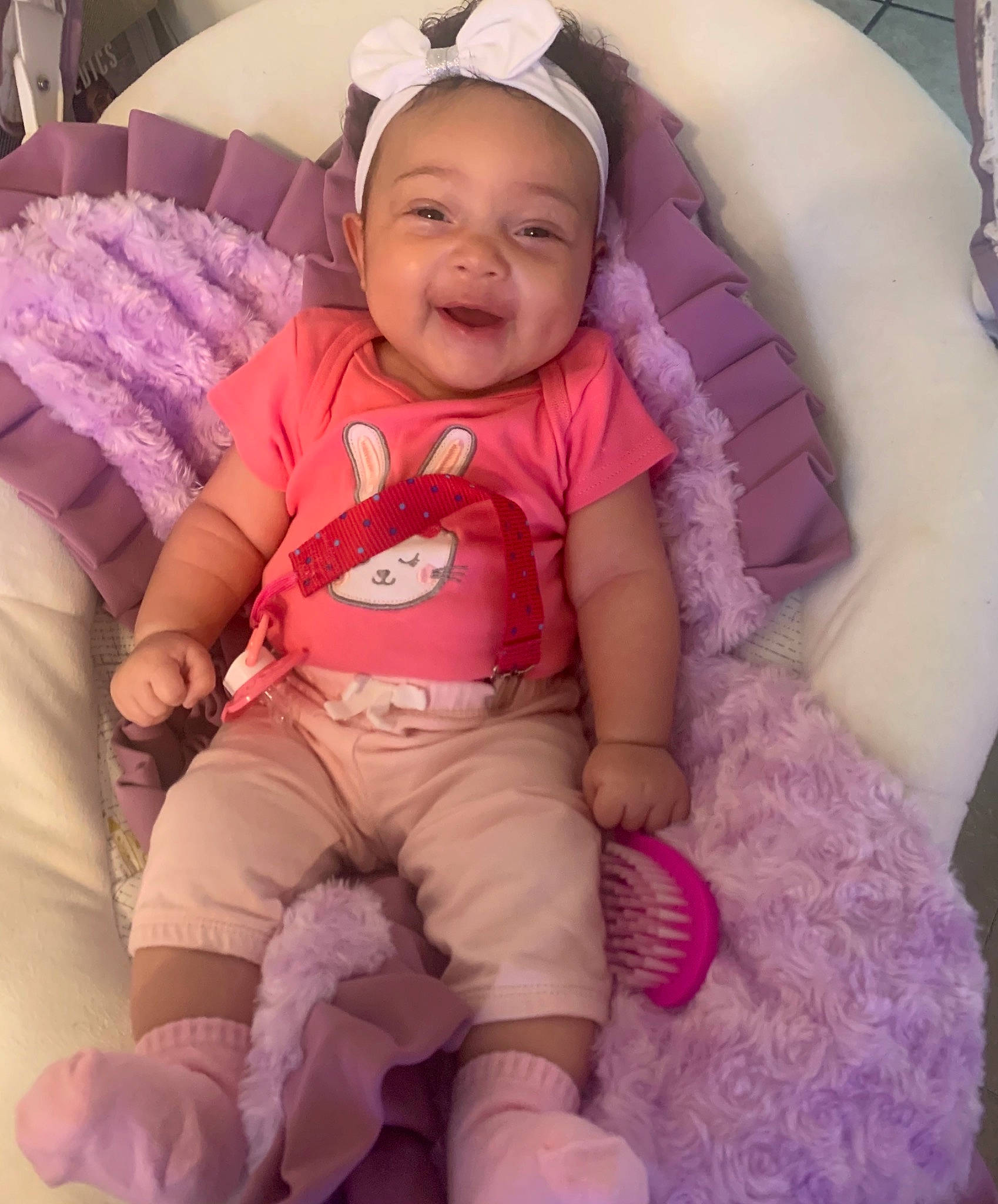 Malani is registered to the contest to win money with this photo: baby, baby_toddler_clothing, cheek, comfort, eye, face, facial_expression, finger, headwear, leg, mouth, organ, person, photograph, pink, product, purple, skin, sleeve, smile