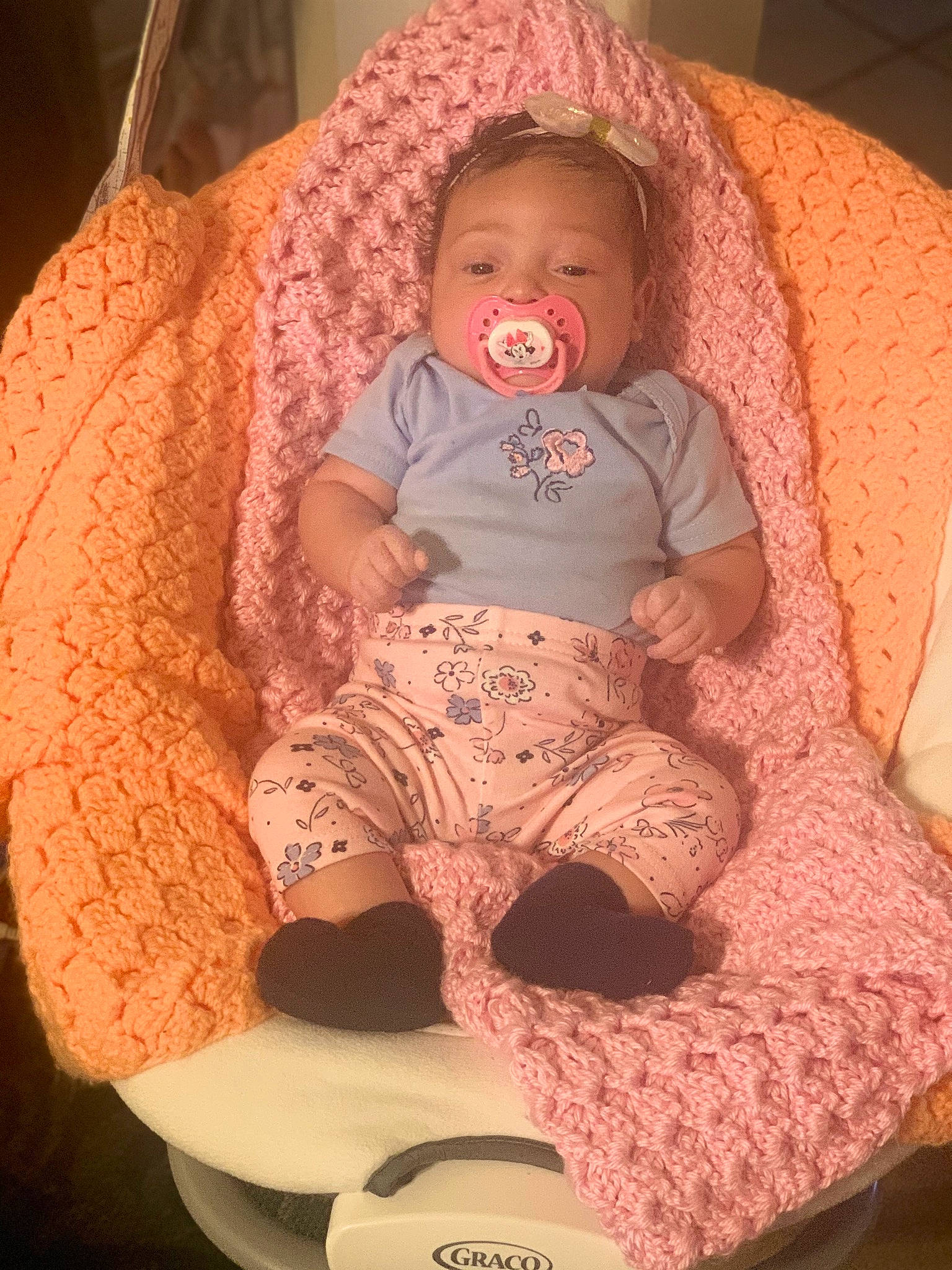 Malani joined the competition — help win amazing prizes! baby, baby_products, baby_toddler_clothing, chair, cheek, child, comfort, fun, human_leg, knee, lap, leg, mouth, organ, person, pink, purple, skin, textile, thigh