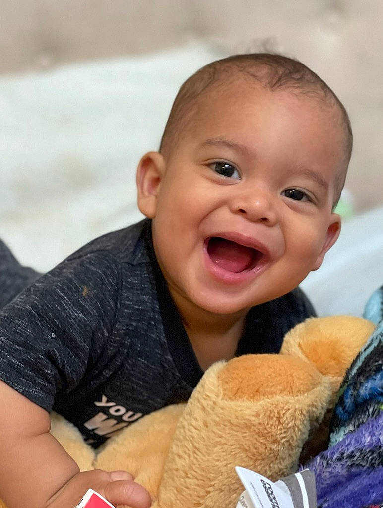 Ja'Zahny joined the competition — help win amazing prizes! baby, cheek, child, comfort, eye, finger, fun, gesture, happy, joy, leisure, nail, nose, person, plush, sitting, skin, smile, stuffed_toy, thumb