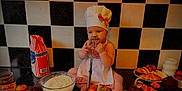 Sofia joined the competition — help win amazing prizes! baby, chef_hat, apron, whisk, baking, kitchen, flour, pastry, croissant, muffin, countertop, food, child, cute, indoor, cooking, dough, milk, strawberry, rolling_pin